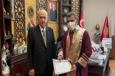 Taşdoğan’a cübbeyi Devlet Bahçeli giydirdi