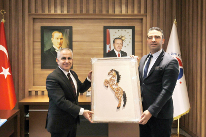 Zeybek’den Rektör Doğan’a ziyaret