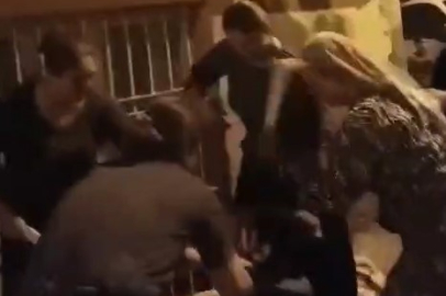 4 kadın, sokakta oturan başka bir kadını sopalarla darp etti